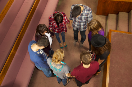 Stock photo of teens praying...